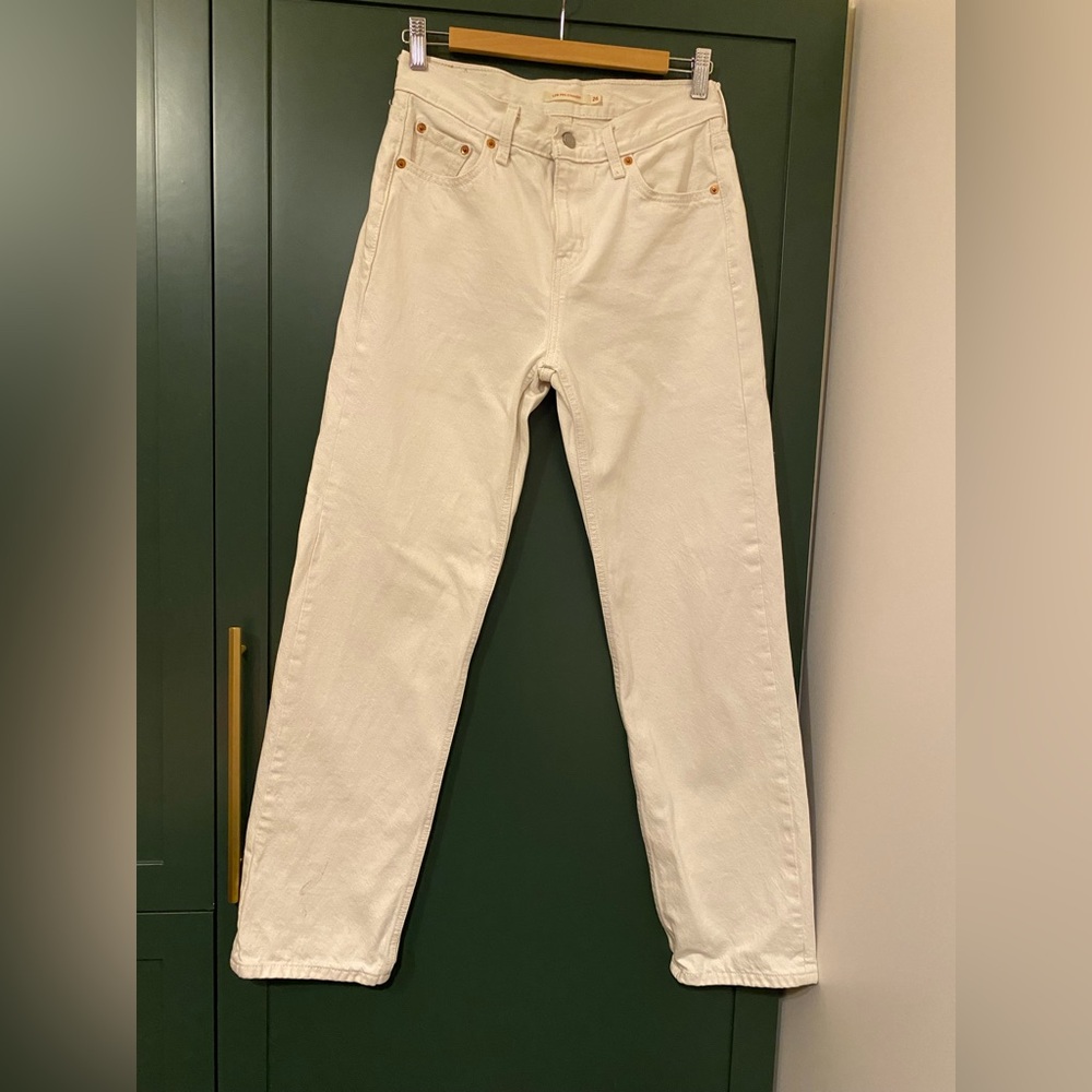 This is a pair of women's Levi's white denim jeans.